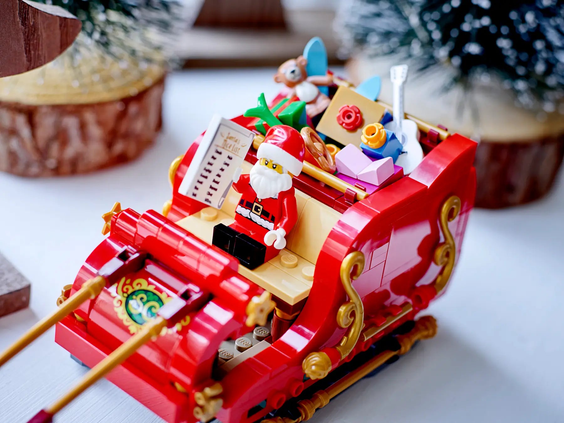 LEGO Santa's sleigh with Santa Claus figure on a white surface